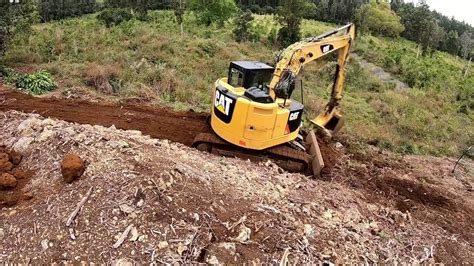 building a road with a mini excavator|Sketchy Road Build with Excavator .